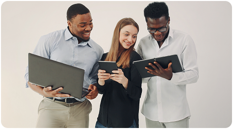 Emelo Digital team collaborating with laptops and tablets.